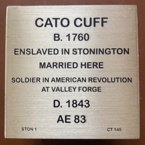 Plaque commemorating Cato Cuff, enslaved in Stonington, soldier in American Revolution, died 1843 at age 83.
