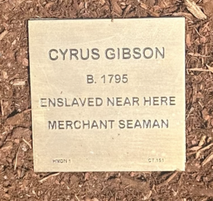 Plaque honoring Cyrus Gibson, born 1795, enslaved nearby, later a merchant seaman.