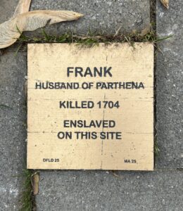 Memorial plaque for Frank, enslaved and killed in 1704; husband of Parthena, marking historical significance.