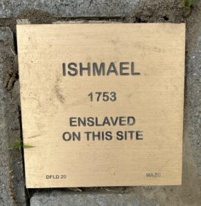 Plaque marking Ishmael's enslavement in 1753 at this site, highlighting historical memory and awareness.