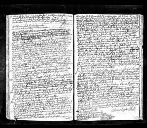 Old handwritten legal document with dense text on both pages, likely a will or contract, showcasing historical writing style.
