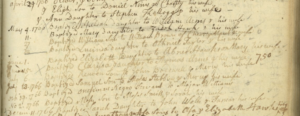 Old paper with handwritten entries of baptisms and dates from the 1700s in cursive script.