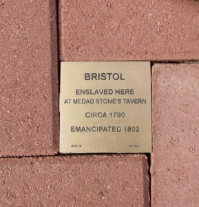 Plaque on brick pathway honoring Bristol, enslaved at Medad Stone's Tavern circa 1790, emancipated 1802.