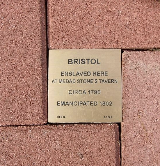 Plaque on brick pathway honoring Bristol, enslaved at Medad Stone's Tavern circa 1790, emancipated 1802.