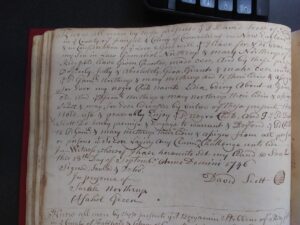 Old handwritten document showcasing historic legal script and ornate penmanship on aged paper.