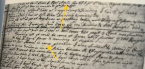 Historical handwritten document with two yellow arrows highlighting specific text sections.