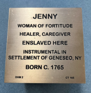 Plaque honoring Jenny: healer, caregiver, instrumental in Geneseo settlement, born circa 1765, enslaved woman of fortitude.
