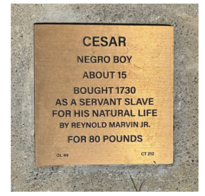 Historical plaque for Cesar, describing his purchase as a servant slave in 1730 for life, at age 15, by Reynold Marvin Jr.