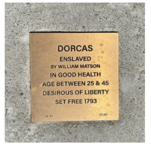 Plaque honoring Dorcas, enslaved by William Matson, set free in 1793. Highlights her desire for liberty and good health.