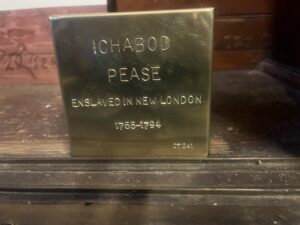 Commemorative plaque for Ichabod Pease, enslaved in New London, 1755-1794, marking historical significance.