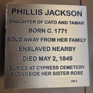 Plaque honoring Phillis Jackson, born 1771, enslaved, died 1849, buried at Cypress Cemetery with sister Rose.