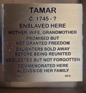 Commemorative plaque for Tamar, documenting her legacy as an enslaved mother and grandmother.
