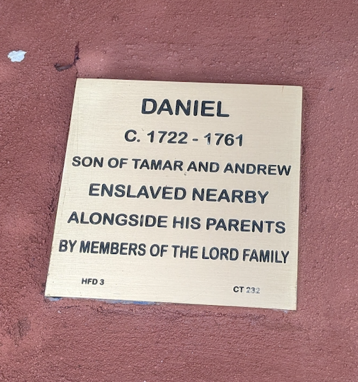 Commemorative plaque for Daniel, enslaved in the 1700s with parents Tamar and Andrew by the Lord family.
