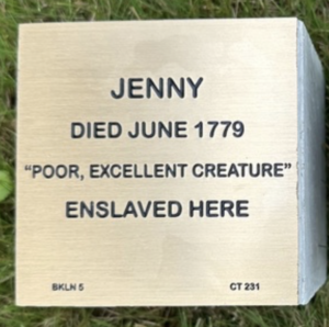 Memorial plaque reading Jenny died June 1779, 'Poor, excellent creature', enslaved here.