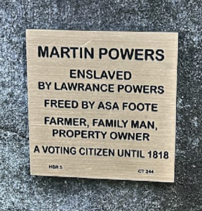 Plaque honoring Martin Powers: former enslaved person, farmer, family man, property owner, voting citizen until 1818.
