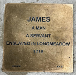 Bronze plaque for James, enslaved in Longmeadow, 1719, memorializing his life and servitude.
