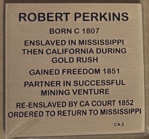 Plaque detailing Robert Perkins' life: From enslavement in Mississippi to freedom during the California Gold Rush era.