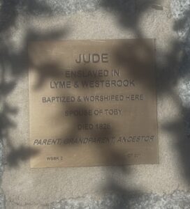 Bronze plaque honoring Jude, enslaved in Lyme & Westbrook, baptized, spouse of Toby, died 1826, ancestor.