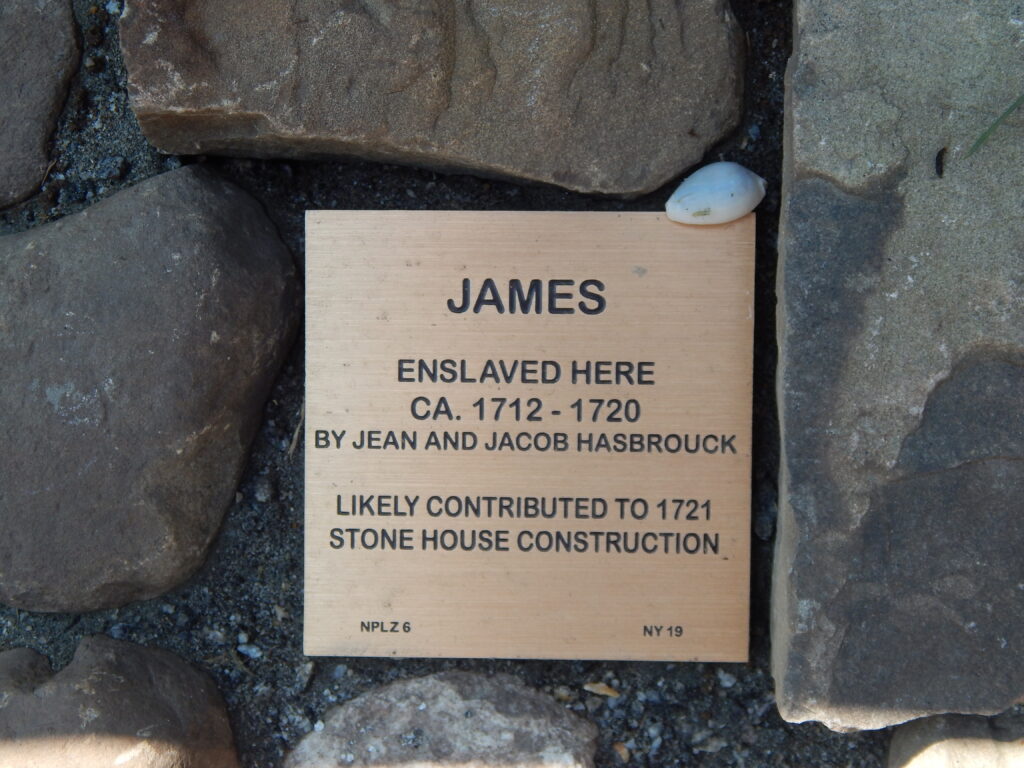 Plaque honoring James, enslaved from 1712-1720, contributed to a 1721 stone house construction by Hasbrouck family.